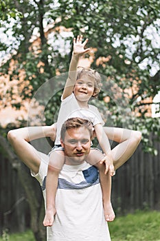 Father and his son playing and hugging in outdoors. Concept of Father`s day.