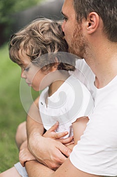 Father and his son playing and hugging in outdoors. Concept of Father`s day.