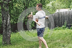 Father and his son playing and hugging in outdoors. Concept of Father`s day.