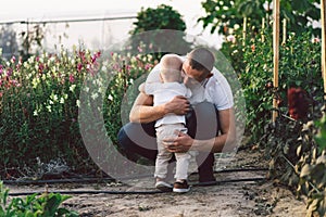 Father and his son playing and hugging in outdoors. Concept of Father`s day