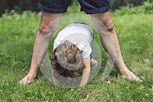 Father and his son playing and hugging in outdoors. Concept of Father`s day.