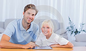 Father and his son using tablet