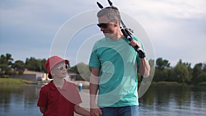 Father and his young son fishing in the evening