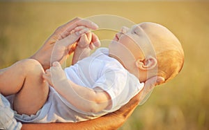 Father is holding his daugther photo