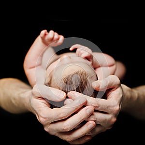 Father holding his newborn baby