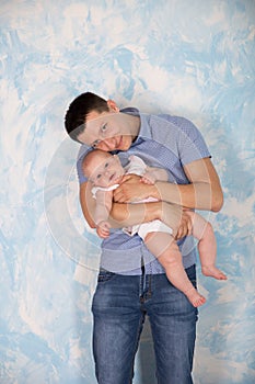 Father is Holding and Hugging His Baby Daughter