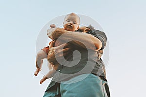 Father holding infant baby family lifestyle dad and child