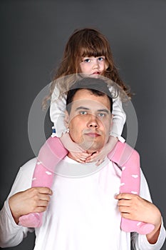 father holding little daughter