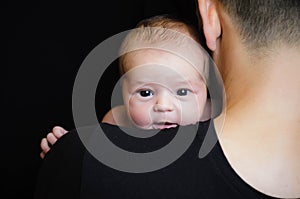 Father holding newborn baby