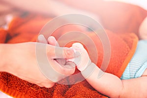 Father holding newborn baby hand. Happy Family concept. Beautiful conceptual image of Maternity, Newborn baby boy hand