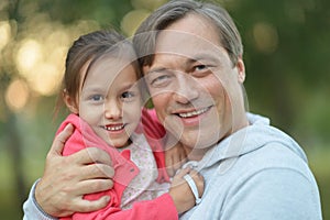 Father hugging his little daughter