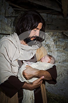 Father Joseph with baby Jesus