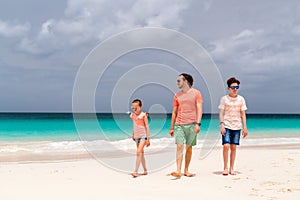 Father with kids at beach