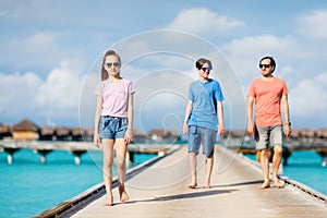 Father with kids at beach