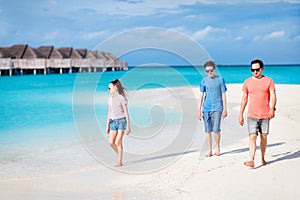 Father with kids at beach