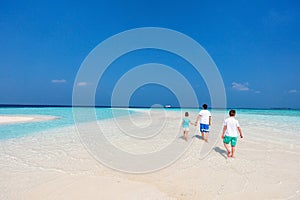 Father with kids at beach