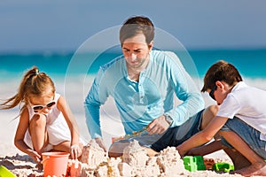 Father with kids at beach