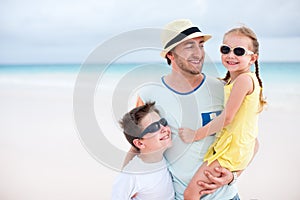 Father with kids at beach