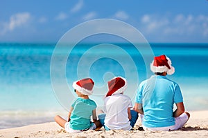 Father with kids at beach on Christmas