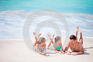 Father and kids enjoying beach summer tropical vacation