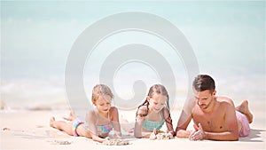 Father and kids enjoying beach summer tropical vacation