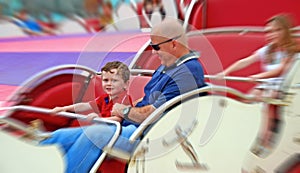 Father and Kids on Fair Ride