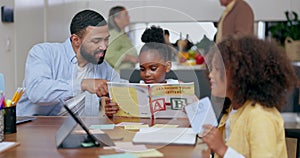 Father, kids and reading book for learning at table in home, knowledge and study alphabet or letters. Dad, teaching