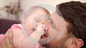 Father kissing daughter at home. Happy father day. Dad kiss baby