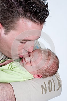 Father kissing his son