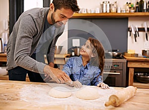 Father, kitchen and happy child baking, helping and dough with flour on counter table, parent together and smile. Family