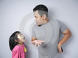 Father and Little Baby Daughter Arguing