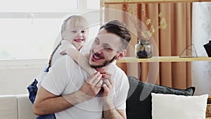 Father with little cute daughter having fun. Fathers day concept
