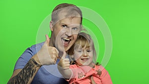 Father and little daughter together looking to camera. Chroma Key. Fathers day