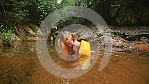 Father Little Girl in Arm-bands Gambol in Pond among Rocks