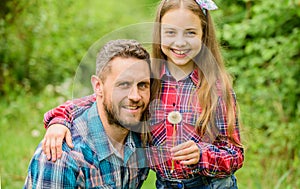 Father little girl enjoy summertime. Dad and daughter blowing dandelion seeds. Keep allergies from ruining your life