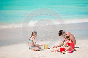 Father and little kids enjoying beach summer tropical vacation.