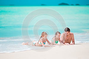 Father and little kids enjoying beach summer tropical vacation. Family playing on the beach