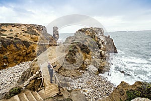 Father and little son admiring nature in Peniche, Portugal