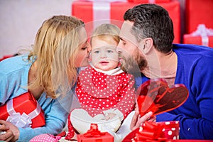 Father, mother and doughter child. Valentines day. Red boxes. Love and trust in family. Bearded man and woman with