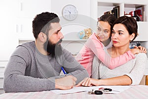 Father and mother preparing divorce papers