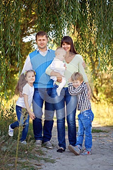 Father, mother, son, daughter and baby together.