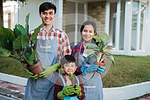 Father mother and son gardening activity together at home garden