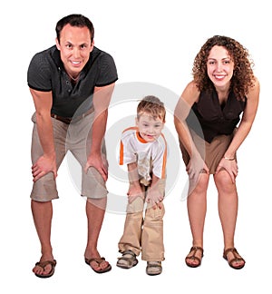 Father, mother and son look having bent down