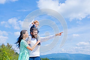 Father mother and son in the park. Freedom to Dream - Joyful Boy Playing With Paper Airplane.