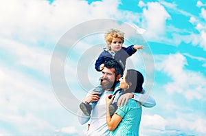 Father mother and son in the park. Freedom to Dream - Joyful Boy Playing With Paper Airplane. Family Time. Parenting