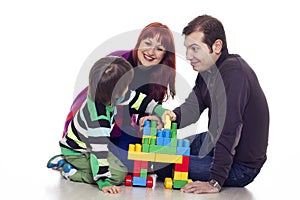 Father, mother and son playing lego