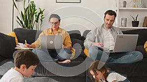 Father and mother working on the distance during quarantine