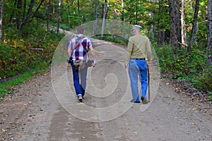 Father and photographer son walking