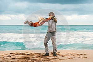 Father playing with child family lifestyle dad and daughter having fun together outdoor walking on the beach summer vacations