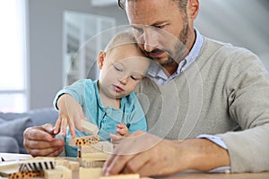 Father playing with his son having fun